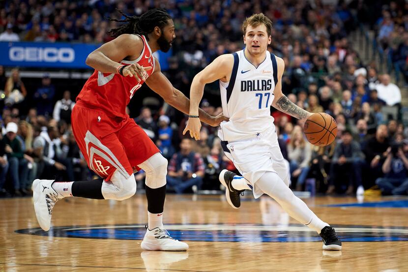 Dallas Mavericks forward Luka Doncic (77) drives to the basket against Houston Rockets...