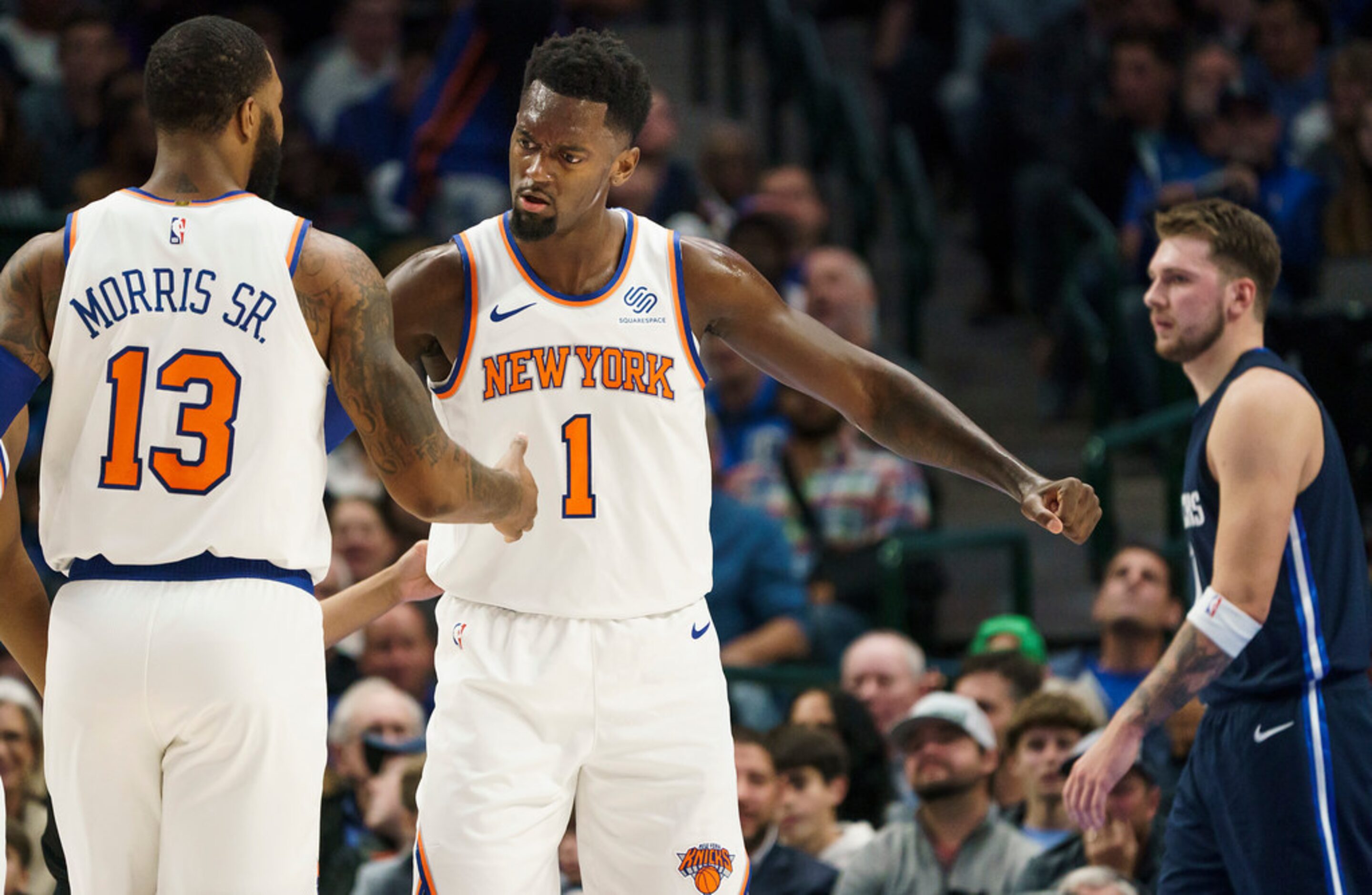 New York Knicks center Bobby Portis (1) celebrates a basket with forward Marcus Morris Sr....