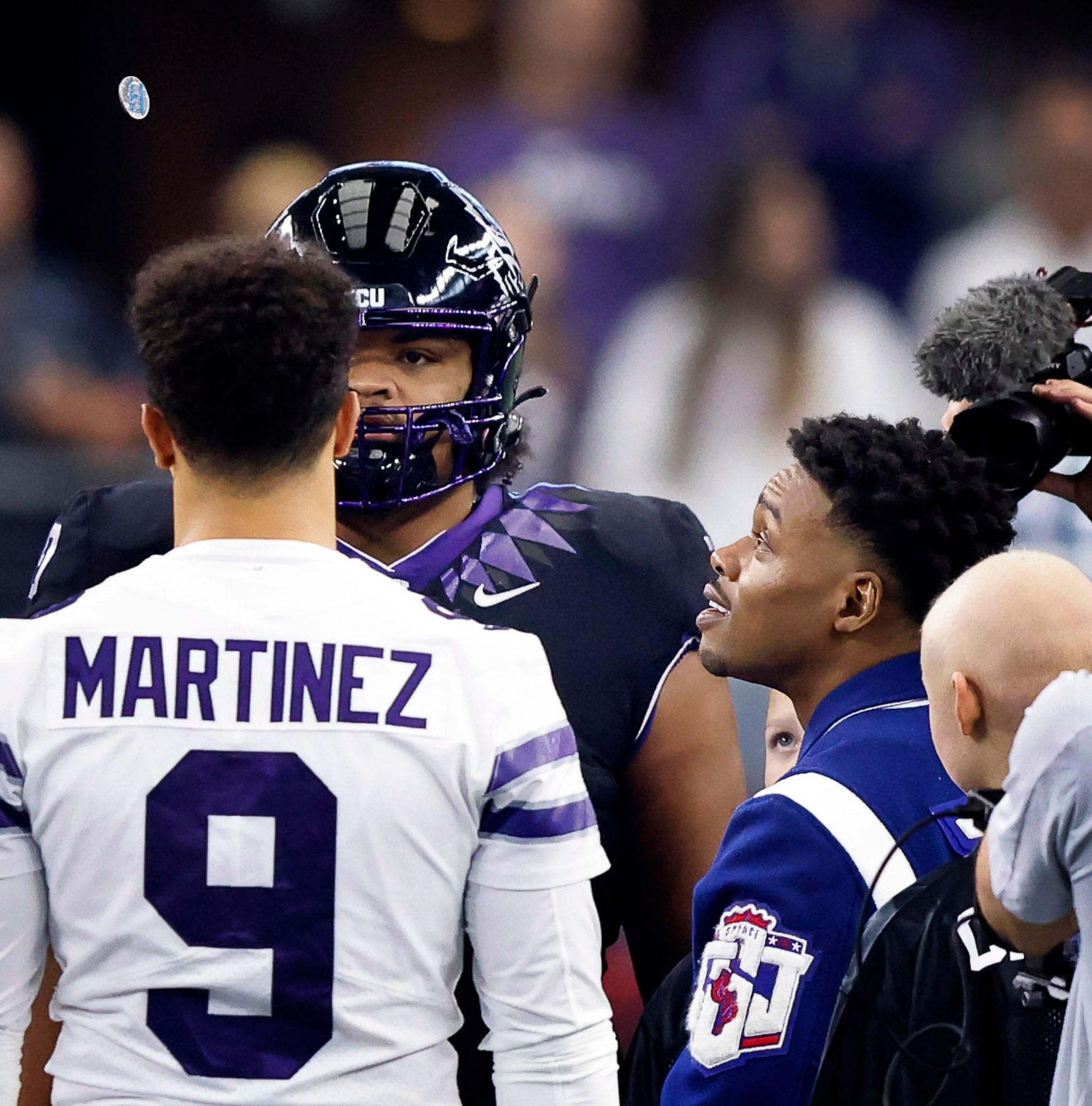 Dallas boxer Errol Spence Jr. (right) tossed the Big XII Championship coin before the...