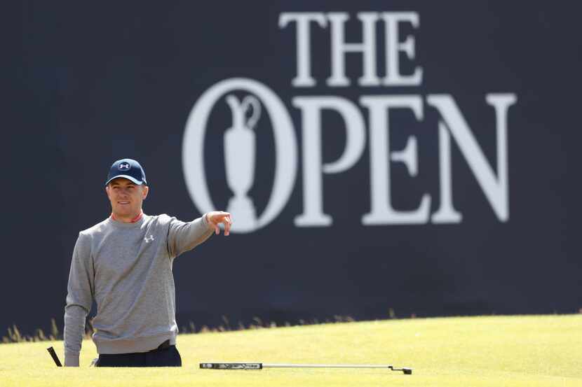 Jordan Spieth of the United States points as he gets ready to play out of a sand trap on the...