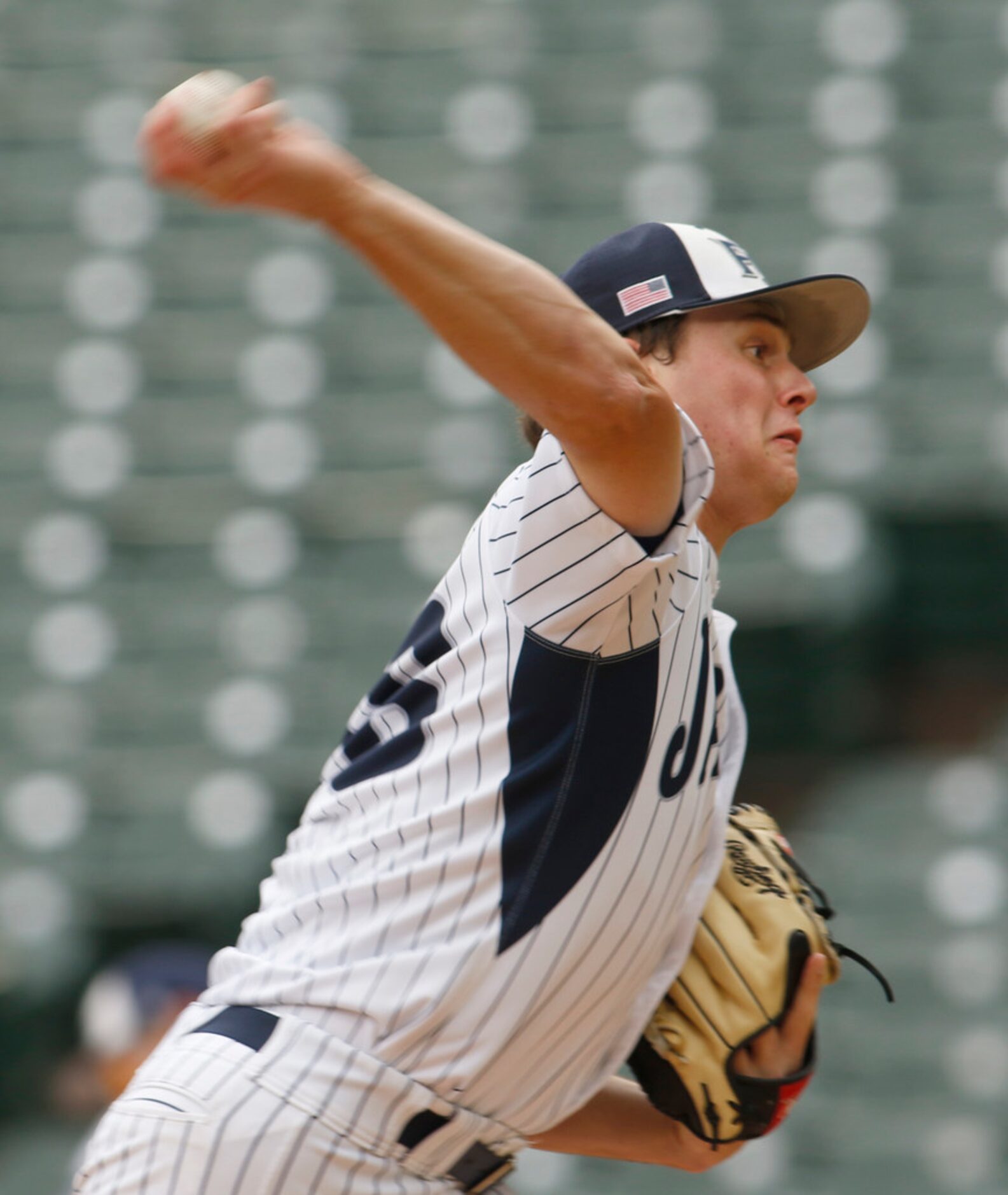 Flower Mound pitcher Cam Brown (18) delivers a pitch to a mansfield Lake Ridge batter during...