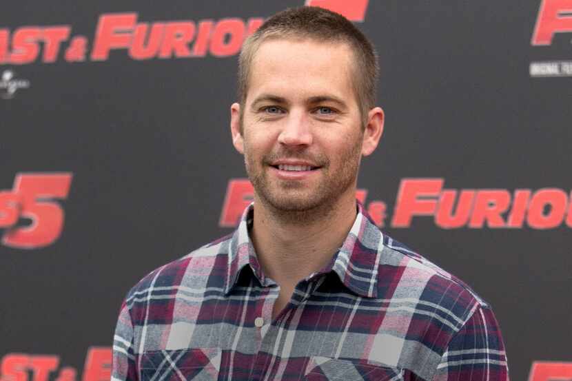 FILE - In this April 29, 2011, file photo, actor Paul Walker poses during the photo call of...