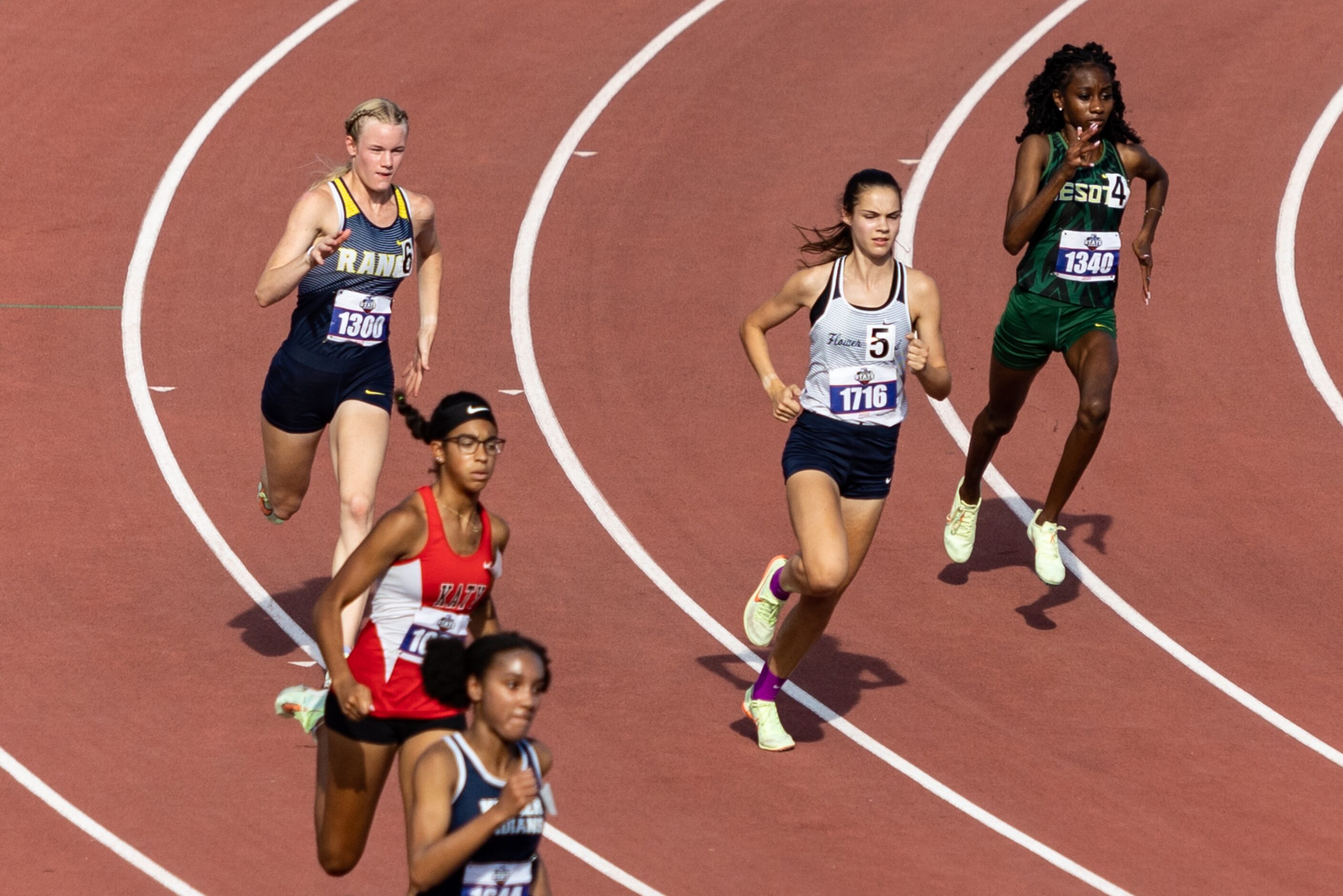 Samantha Humphries of Flower Mound, second from the left, races in the girls’ 800-meter...