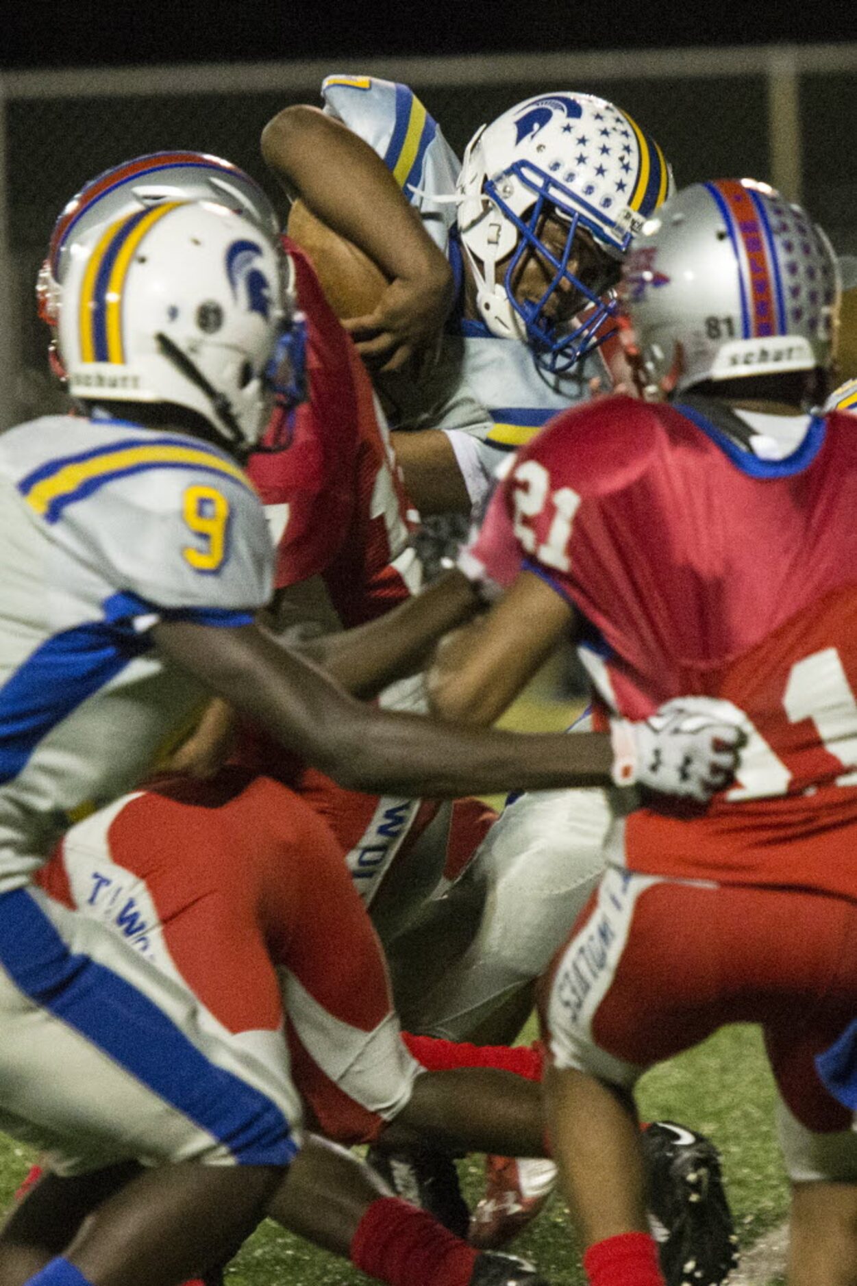 Samuell's Barry Henry (7) pushes through the line to score during W. W. Samuell's matchup...