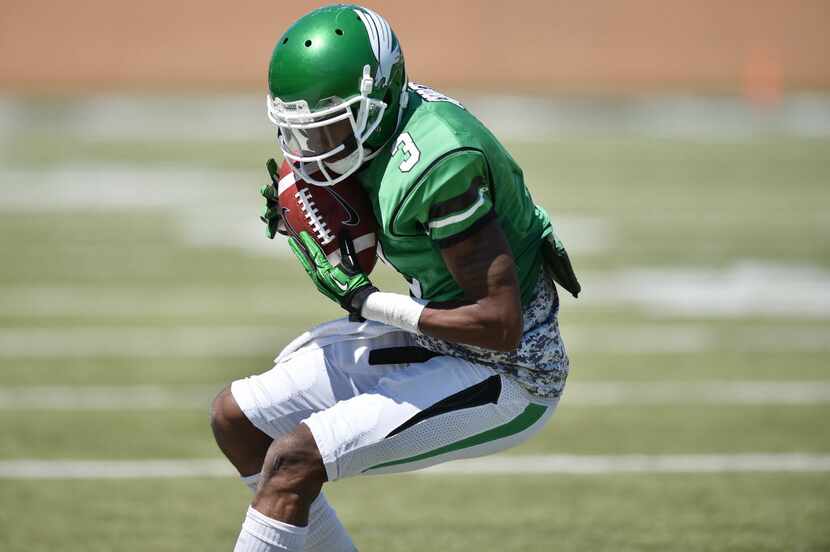 North Texas sophomore wide receiver Tee Goree (3) brings the ball in close after a catch in...