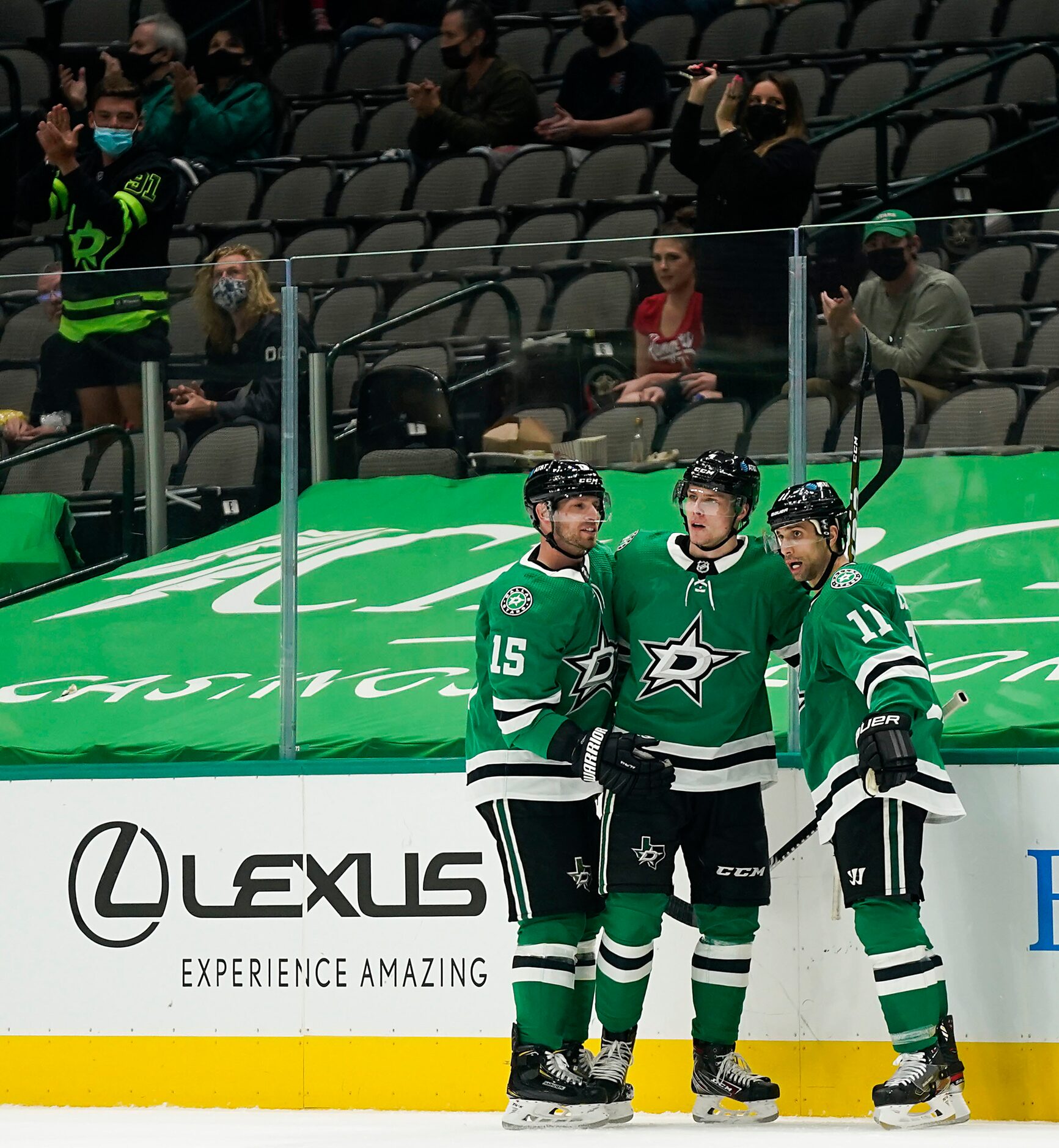 Dallas Stars defenseman Miro Heiskanen (4) celebrates a goal with left wing Blake Comeau...