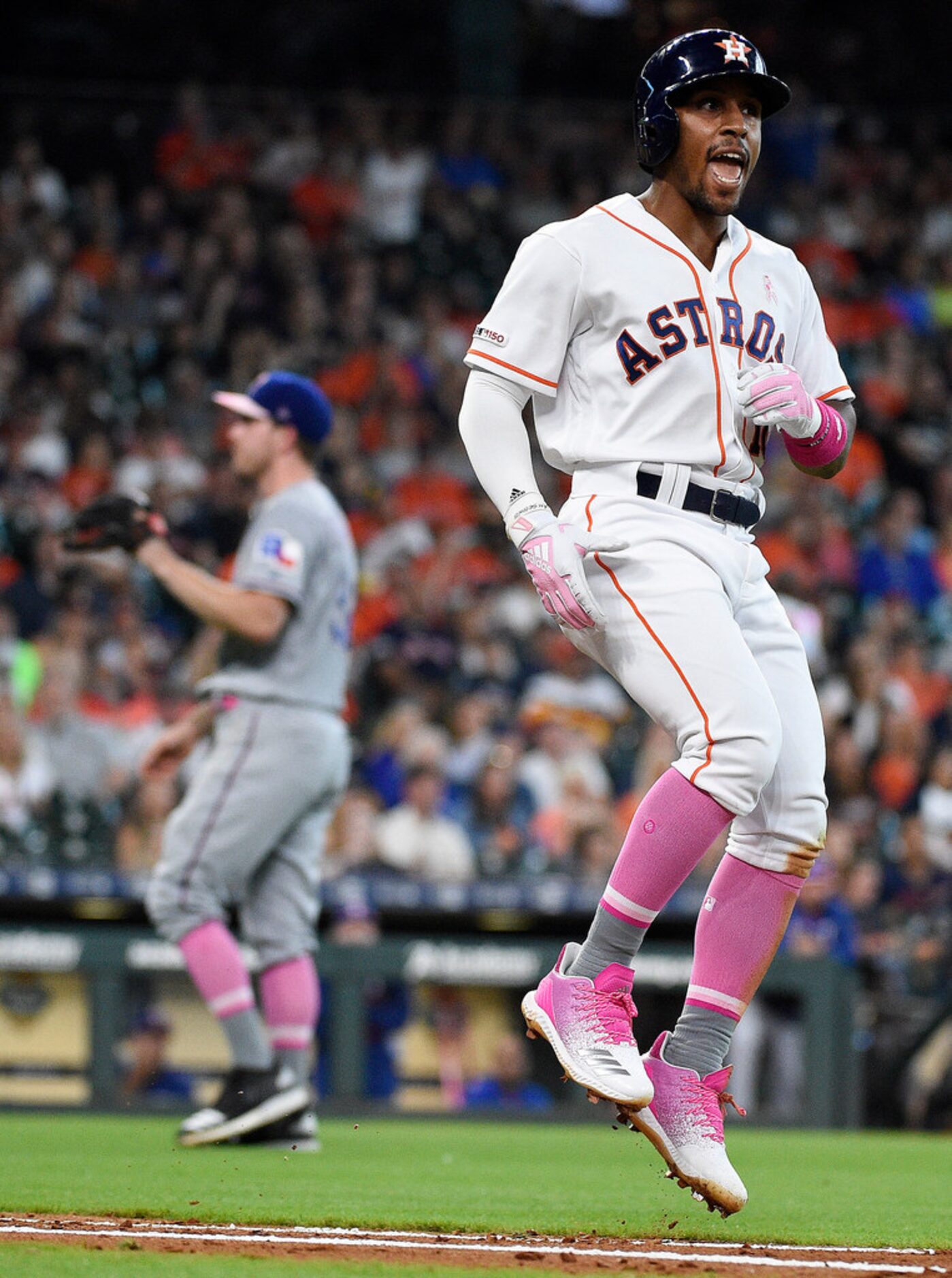 Houston Astros' Tony Kemp, right, reacts after hitting a foul ball just shy of being a home...