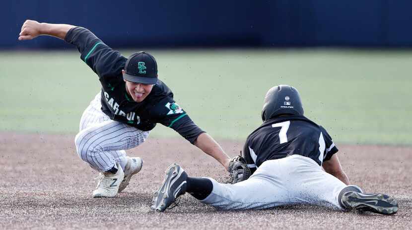 Southlake Carroll's Jake Murphy (1) tags Arlington Martin's Chet Lytle (7) on an attempt to...