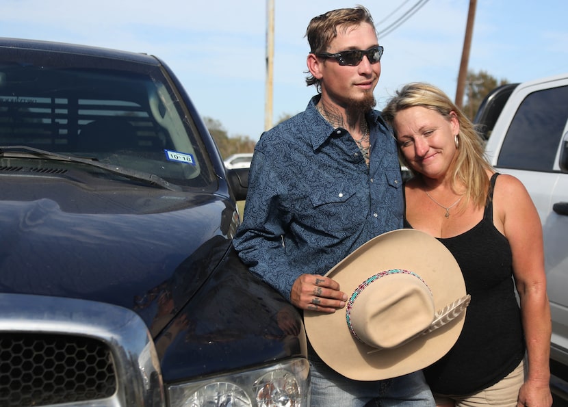 Johnnie Langendorff poses for a photo with his mother Heather Langendorff by the truck he...