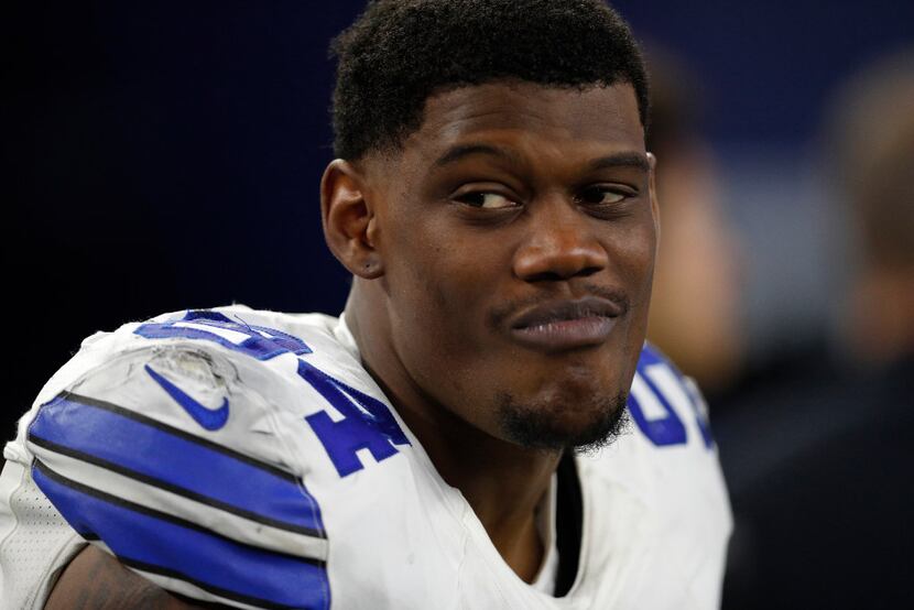 Dallas Cowboys' Randy Gregory sits on the sideline during an NFL football game against the...