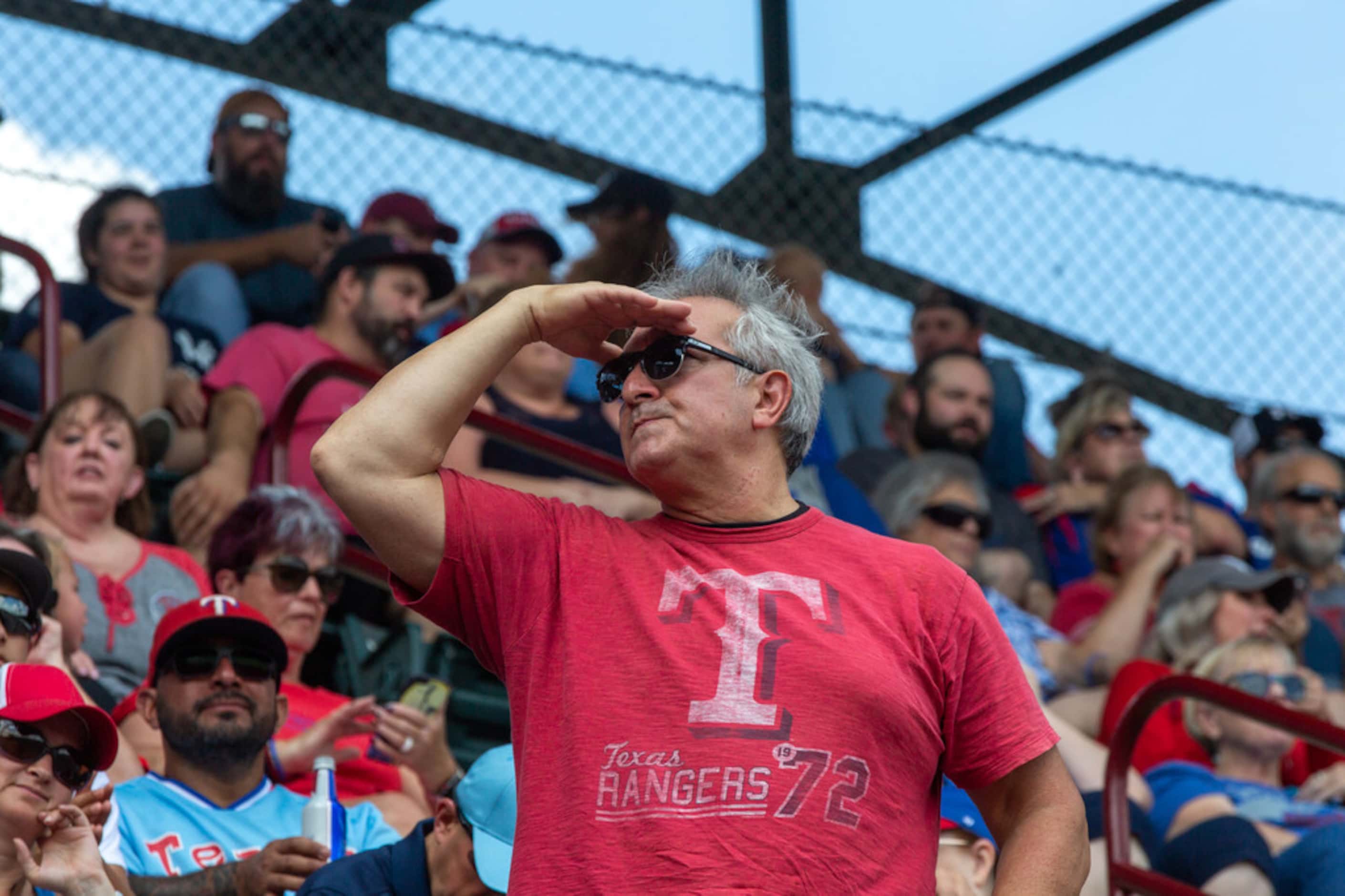 A fan look out at the ball park during the Texas Rangers' final game ever played at Globe...