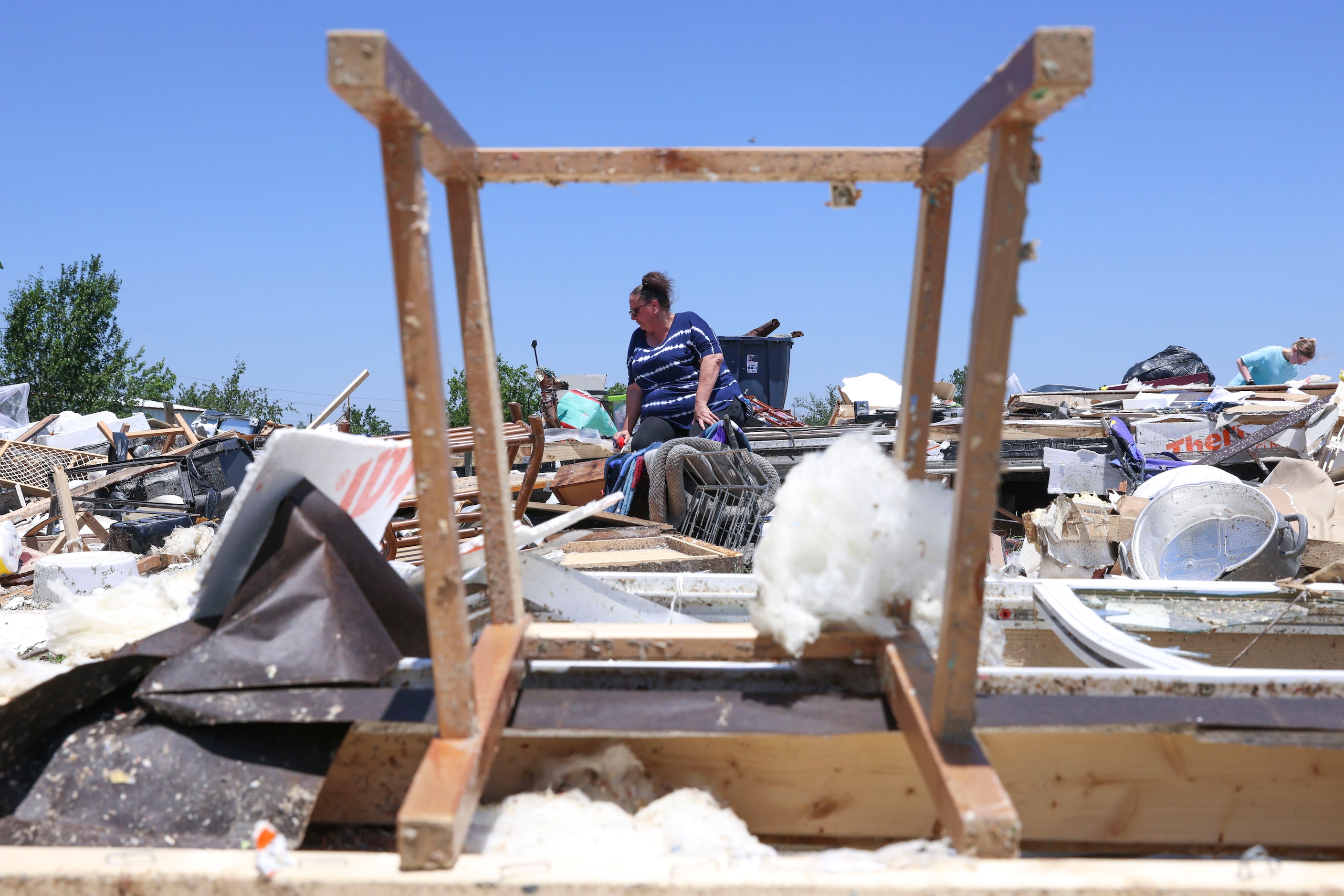 Amber Lidster, 44, resident of Valley View for 40 years, seen through a damaged chair,...