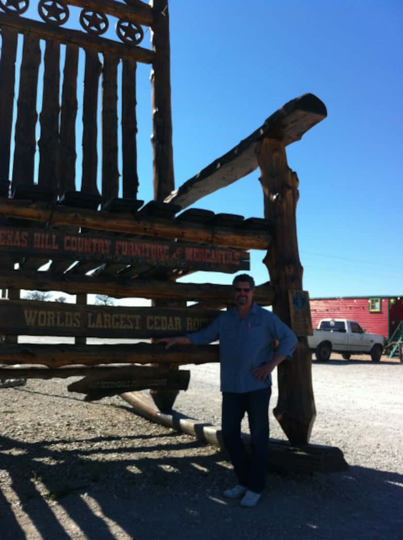 The world's largest cedar rocking chair sits in front of Natty Flat Smokehouse and Texas...