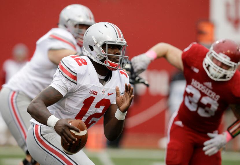 Ohio State's Cardale Jones runs during the second half of an NCAA college football game...