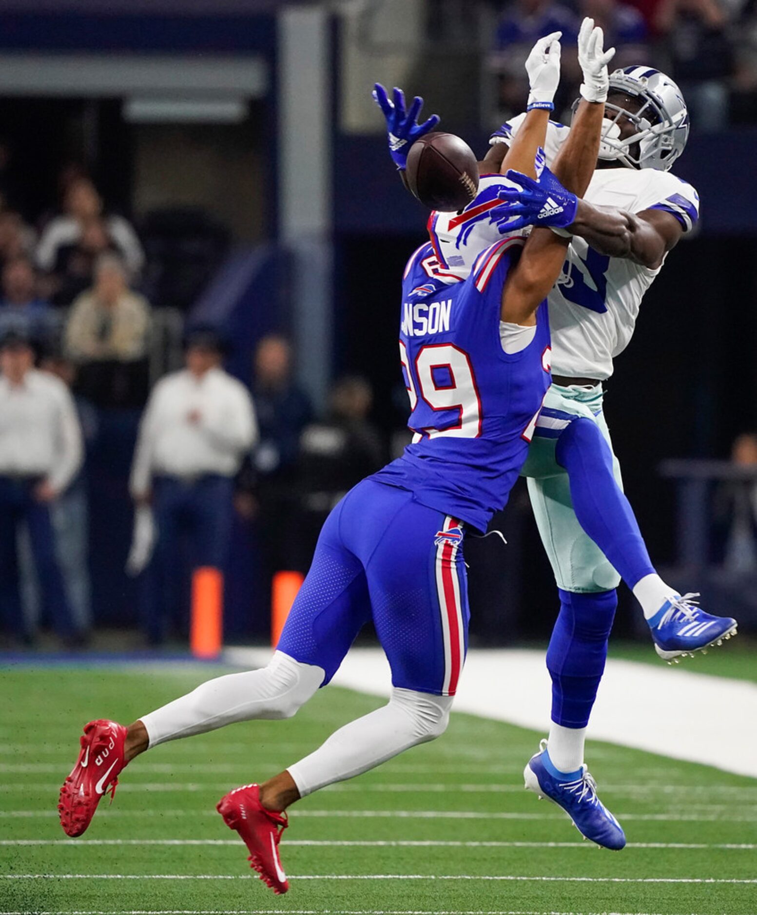 Buffalo Bills cornerback Kevin Johnson (29) breaks up a pass intended for Dallas Cowboys...