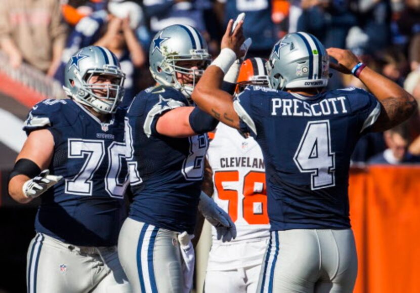 Dallas Cowboys tight end Jason Witten (82) celebrates a touchdown with quarterback Dak...