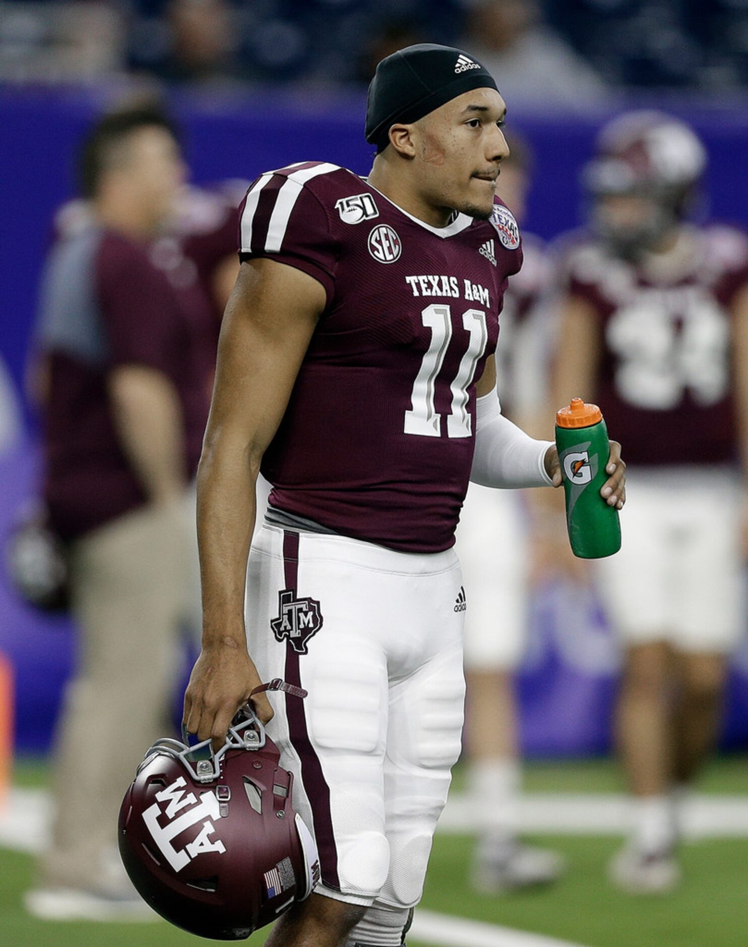 HOUSTON, TEXAS - DECEMBER 27: Kellen Mond #11 of the Texas A&M Aggies warms up before...