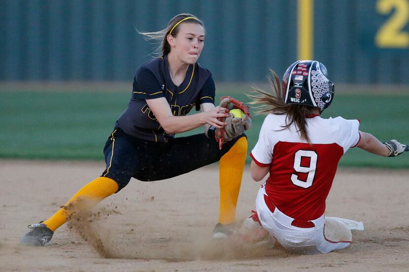 Forney shortstop Caleigh Cross (23) was unable to get the tag down in time to get Lovejoy...
