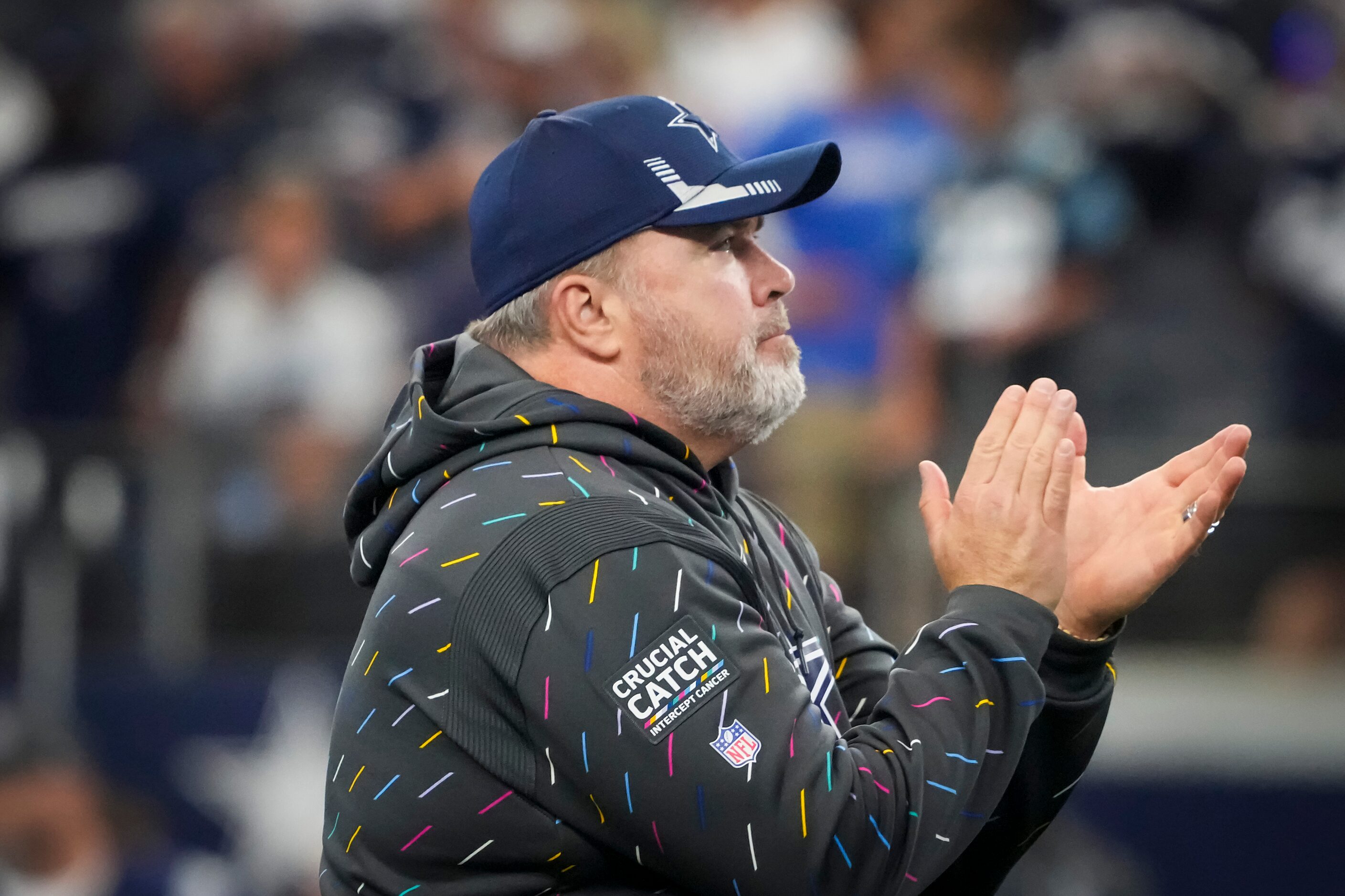 Dallas Cowboys head coach Mike McCarthy cheers his team as they warm up before an NFL...