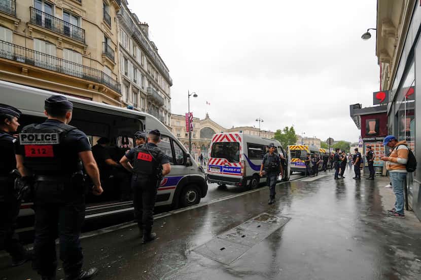 Policemen patrol the Gare de L'Est ahead of the 2024 Summer Olympics, Friday, July 26, 2024,...
