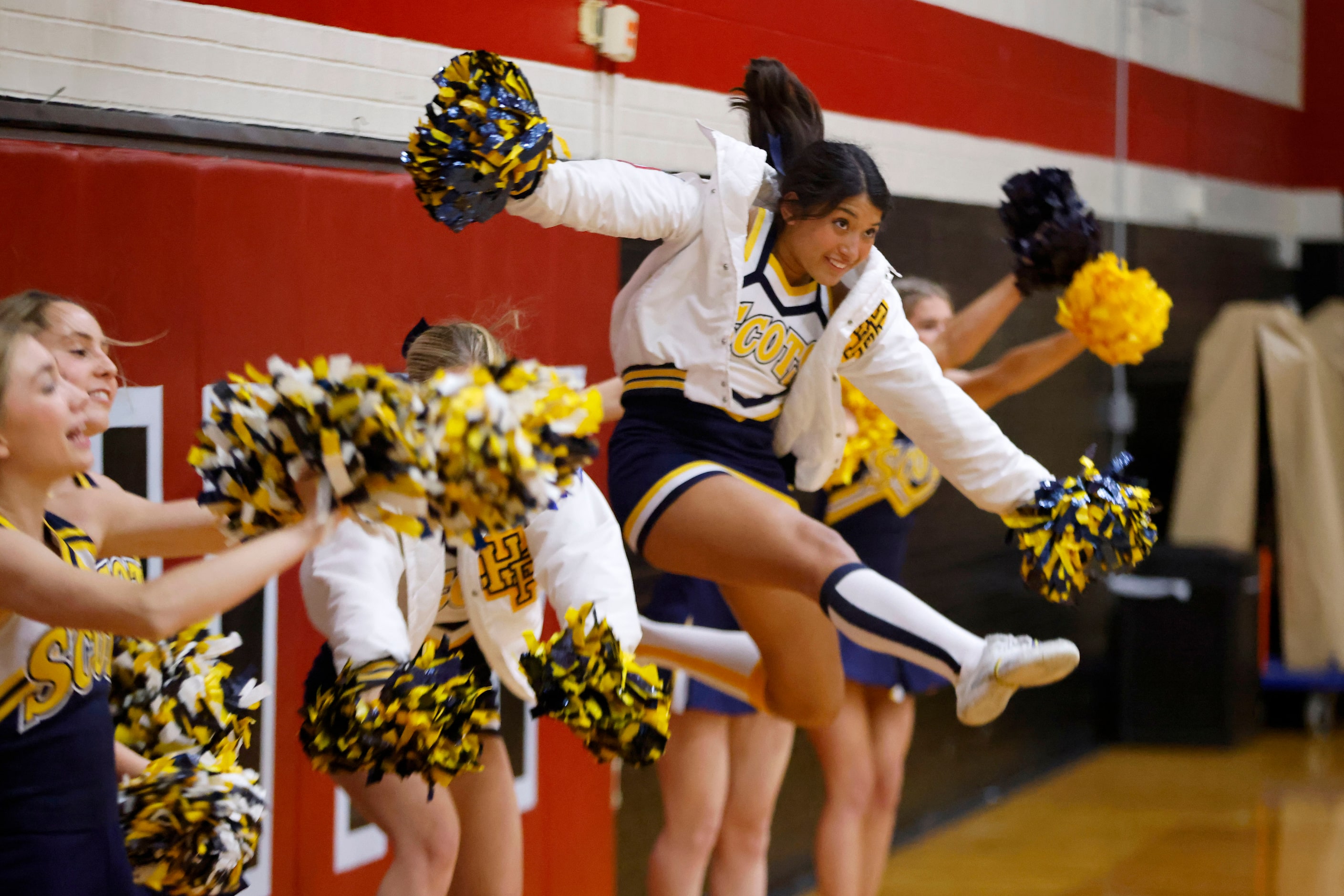 Highland Park cheerleaders support their team as they played Coppell during the first half...