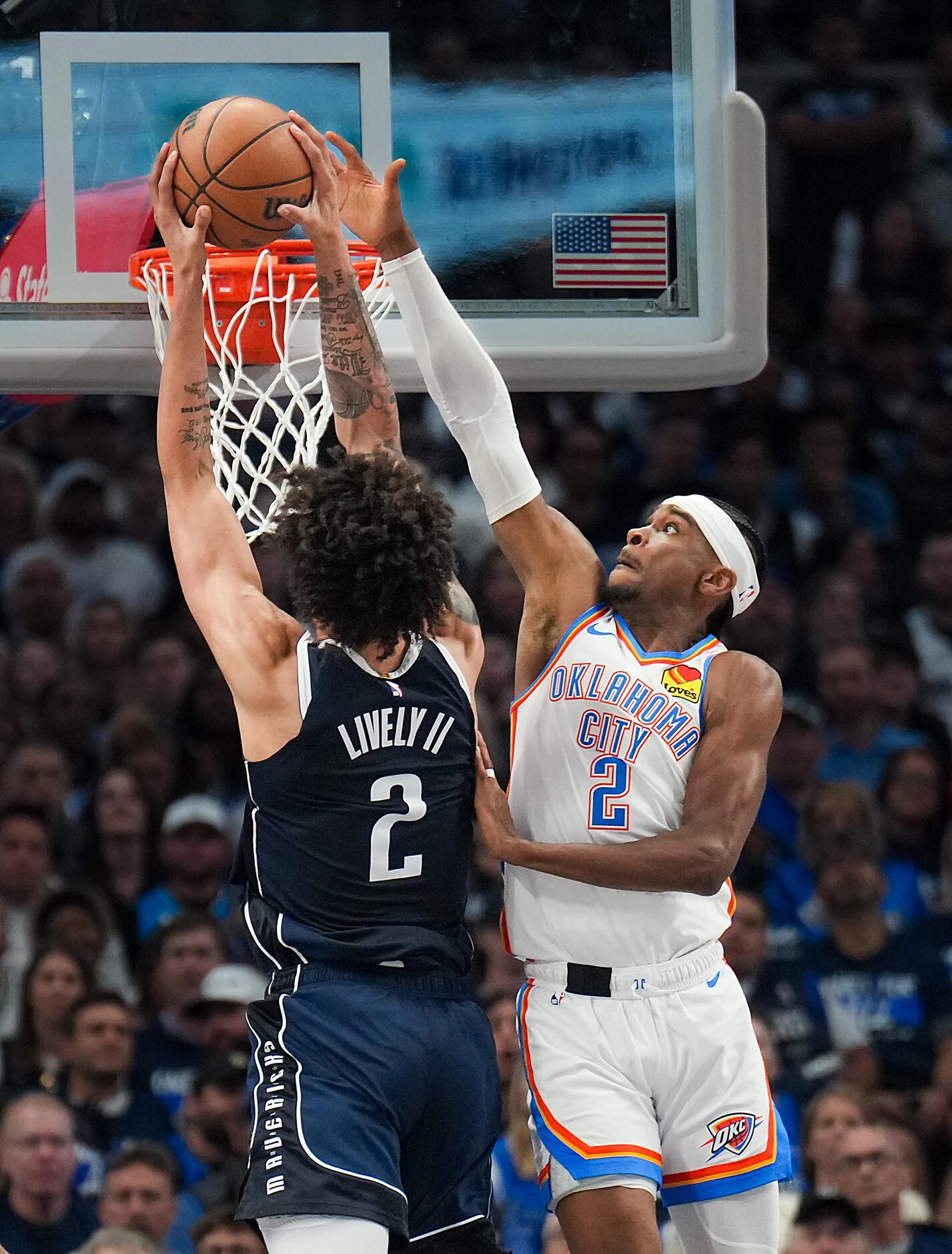 Dallas Mavericks center Dereck Lively II dunks the ball past Oklahoma City Thunder guard...