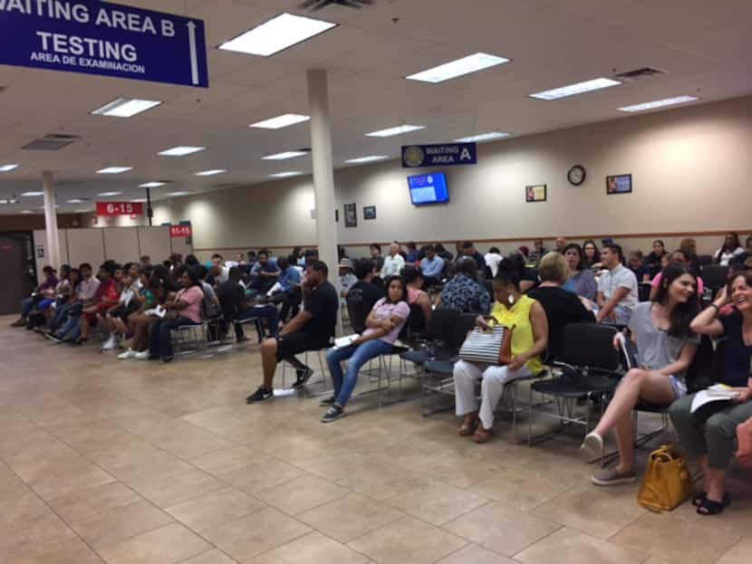 Only a few seats are empty at the driver's license mega center in Garland. The wait on this...