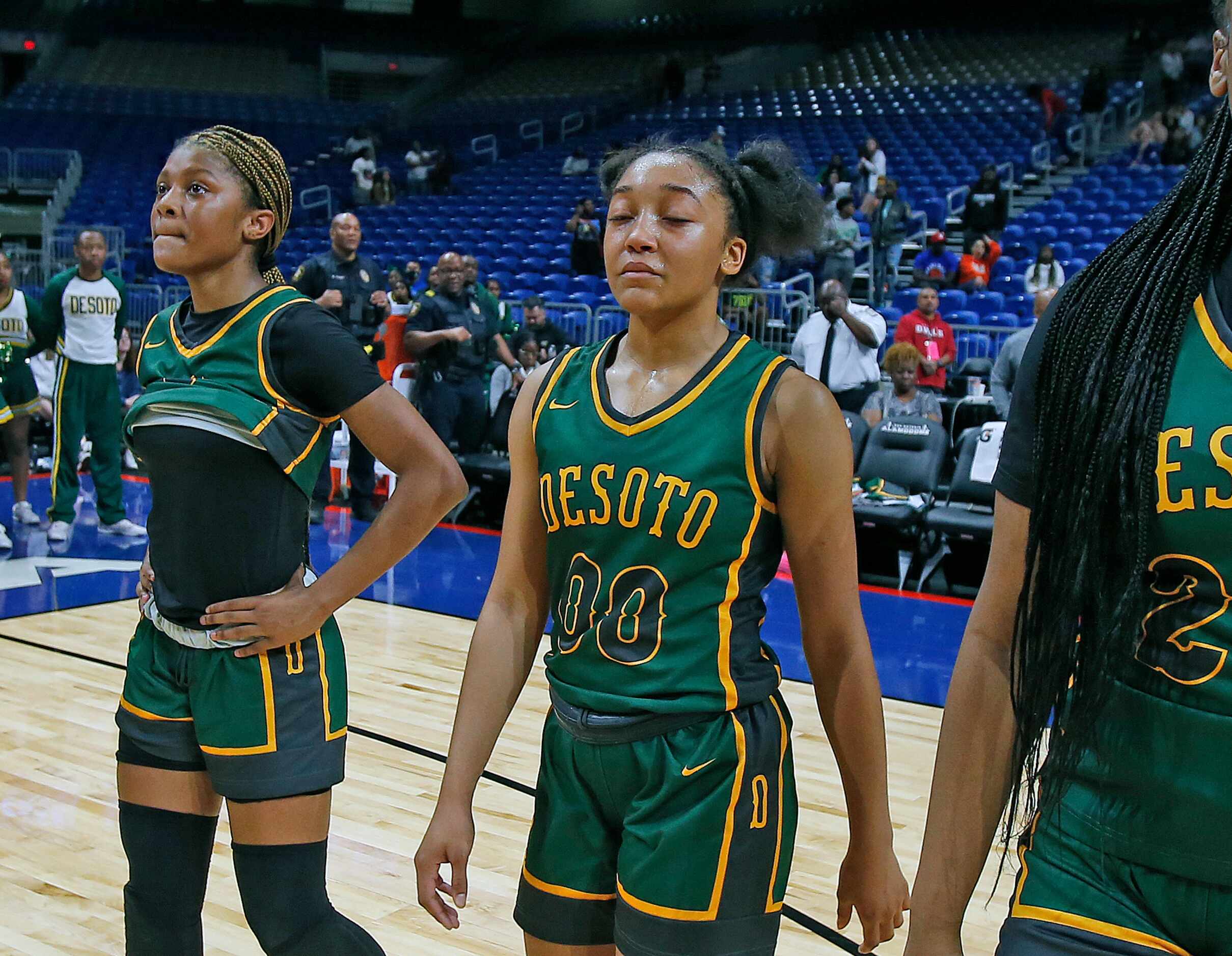 Desoto Mylasia Smith (00) walks off the court showing their disappointment along with the...