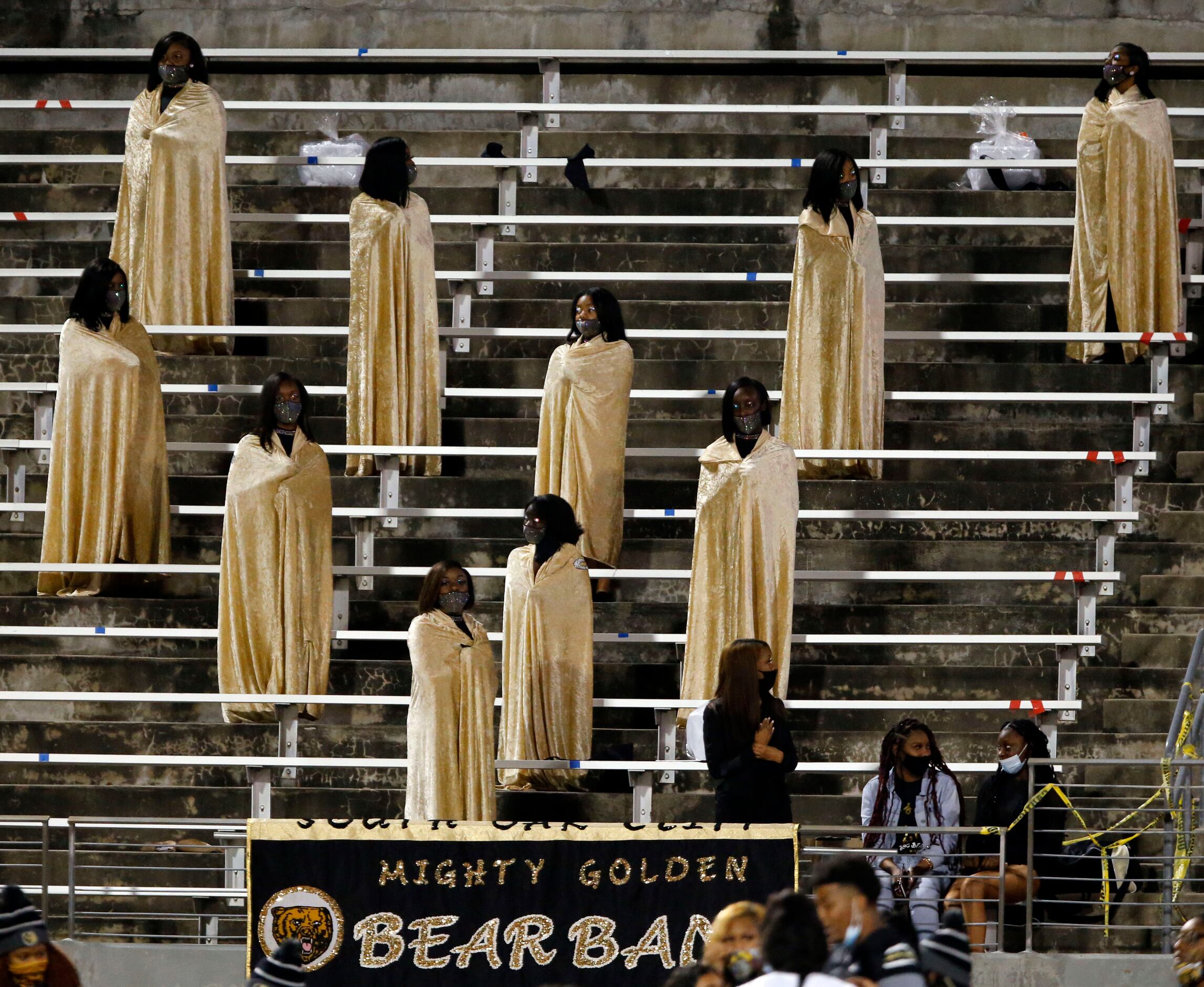 South Oak Cliff’s robe-clad dancers await the start of the first half of high school...