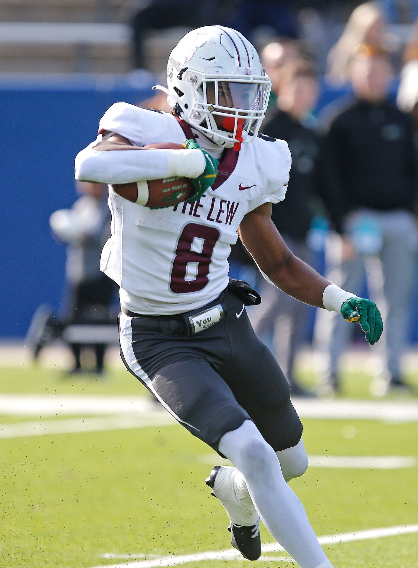 Lewisville High School defensive back Caden Jenkins (8) returns a kickoff during the first...