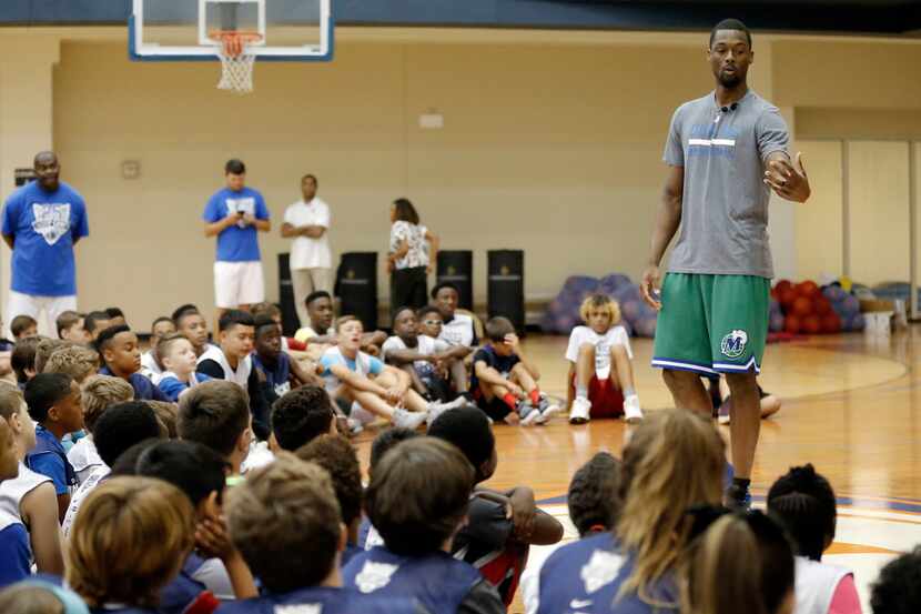 Dallas Mavericks forward Harrison Barnes mentors campers during the Mavs Basketball Academy...