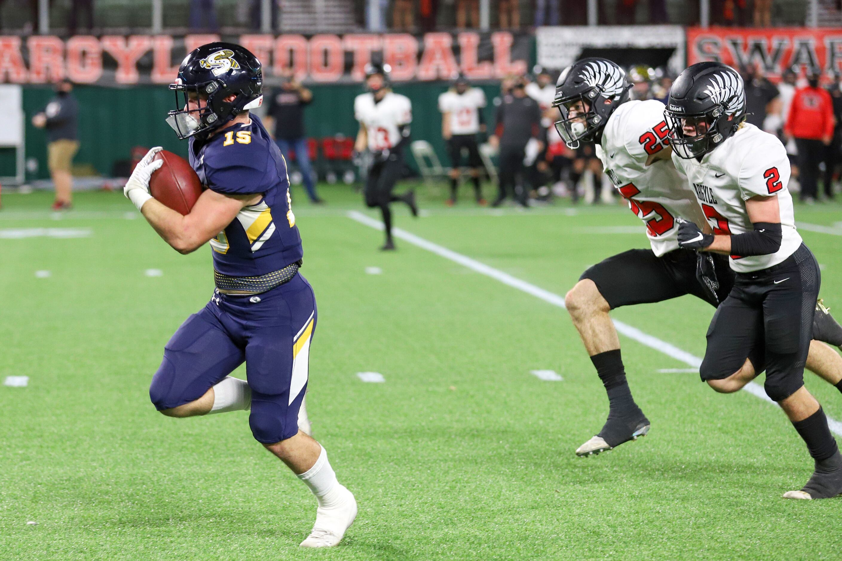 Stephenville running back Kason Philips (15) runs for a touchdown in front of Argyle...
