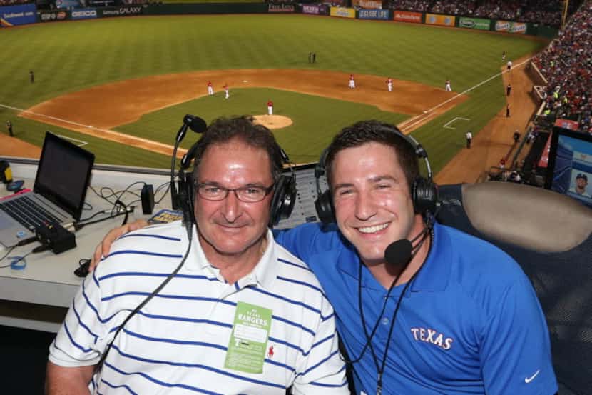 Jared Sandler (right) sits in the Rangers booth with his father Alan Sandler 07112015xSPORTS