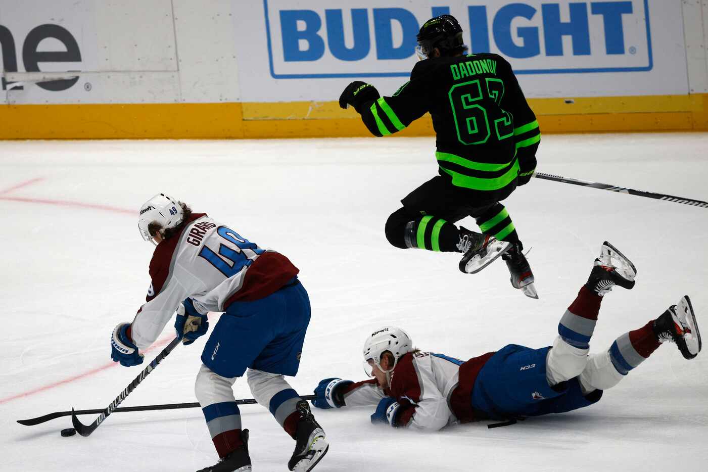 Dallas Stars right wing Evgenii Dadonov (63) jumps over Colorado Avalanche defenseman Bowen...