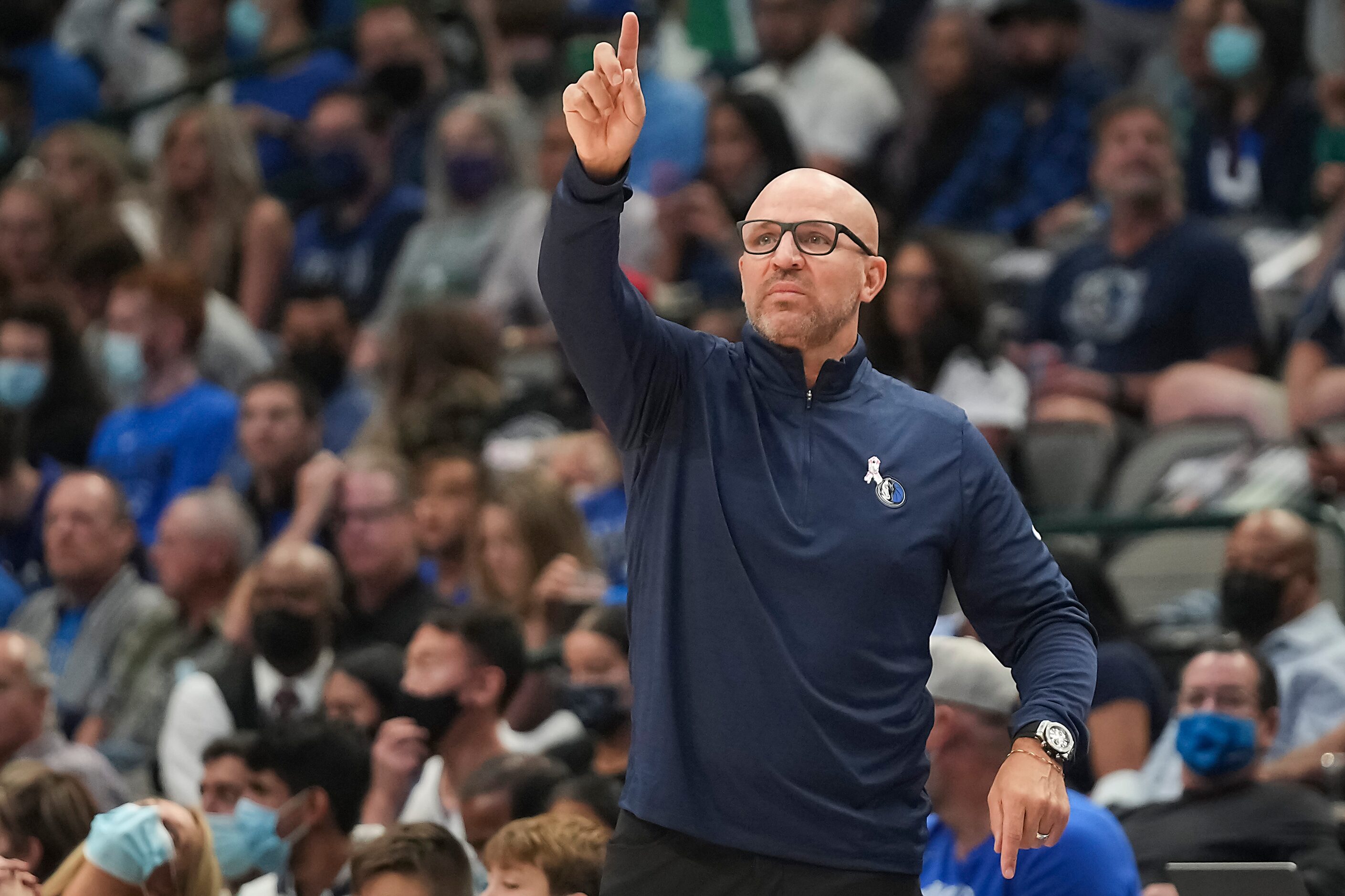 Dallas Mavericks coach Jason Kidd calls a play during the first half of an NBA basketball...