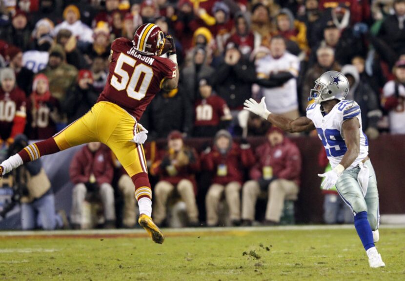 Washington Redskins outside linebacker Rob Jackson (50) intercepts a pass intended for...