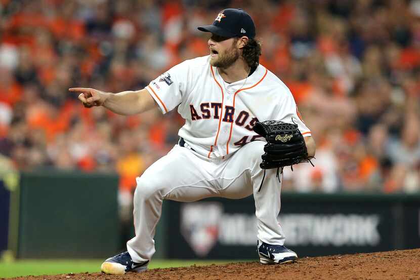HOUSTON, TEXAS - OCTOBER 05:  Gerrit Cole #45 of the Houston Astros reacts after his 14th...