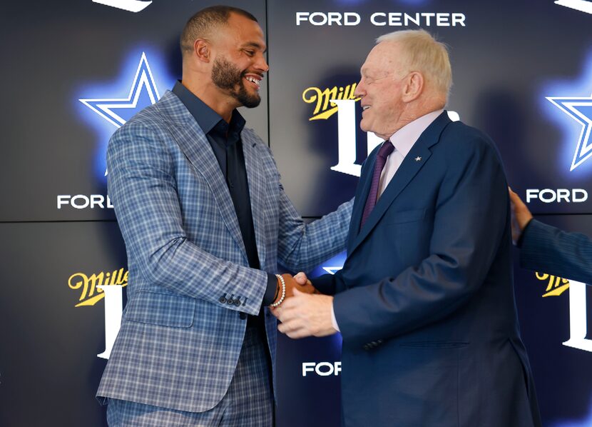 Dallas Cowboys quarterback Dak Prescott (left) and Dallas Cowboys owner Jerry Jones shake...