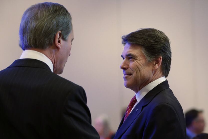 Gov. Rick Perry talked with Lt. Gov. David Dewhurst before his address to the Texas Business...