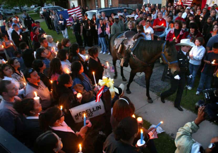 C.M. Grady, a Fort Worth mounted patrol officer, led her riderless horse through the crowd...