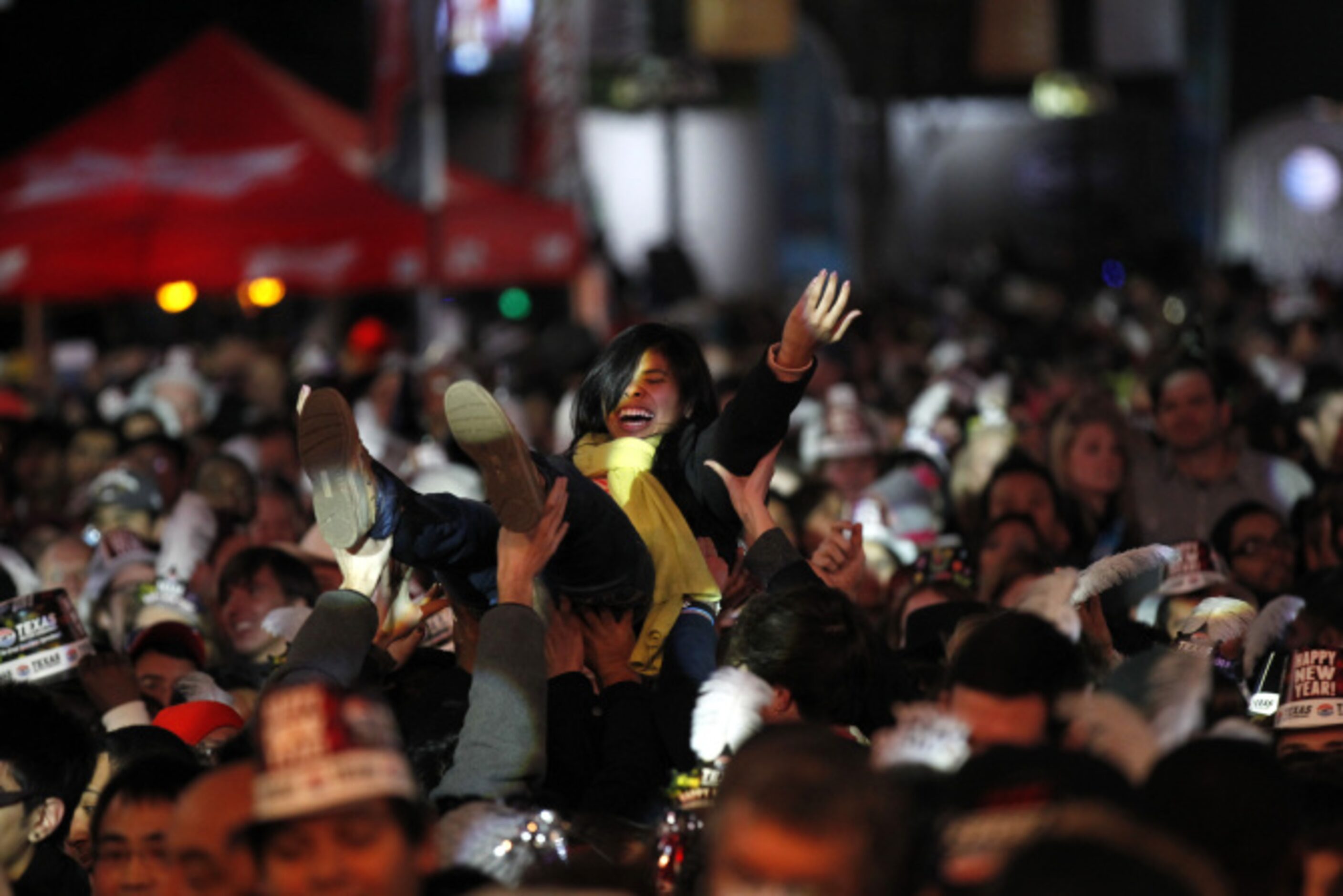 Crowd surfing at Big D New Years Eve celebration at American Airlines Center in Dallas...