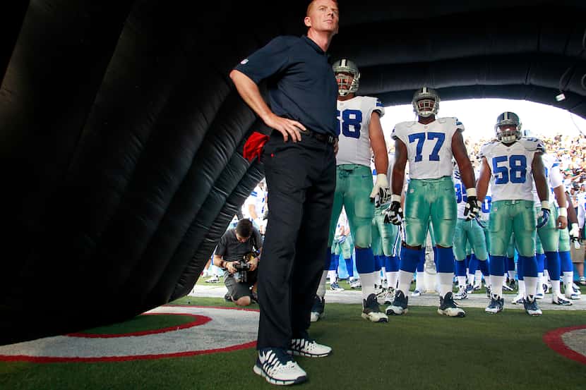 Dallas Cowboys head coach Jason Garrett waits in the tunnel with his players 