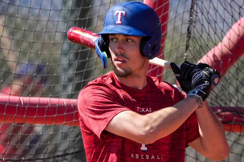 Outfielder Evan Carter takes batting practice during a Texas Rangers minor league spring...
