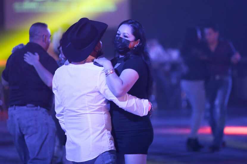 DALLAS, TX - MARCH 12: Young couple dance during a music concert at the Farwest Nightclub.....