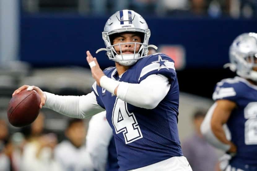 Dallas Cowboys quarterback Dak Prescott (4) throws during pregame warmups before facing the...