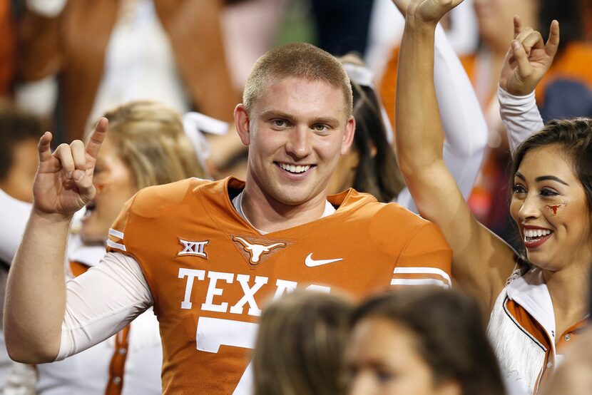 AUSTIN, TX - NOVEMBER 17:  Shane Buechele #7 of the Texas Longhorns celebrates after the...