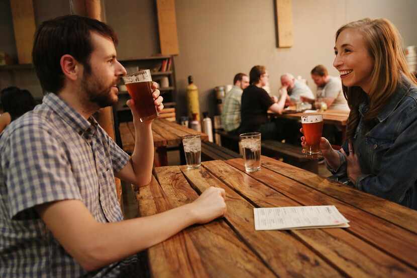 Greg Spagnolo and Jaci Spagnolo, of Dallas, drink beers inside Small Brewpub in Oak Cliff.