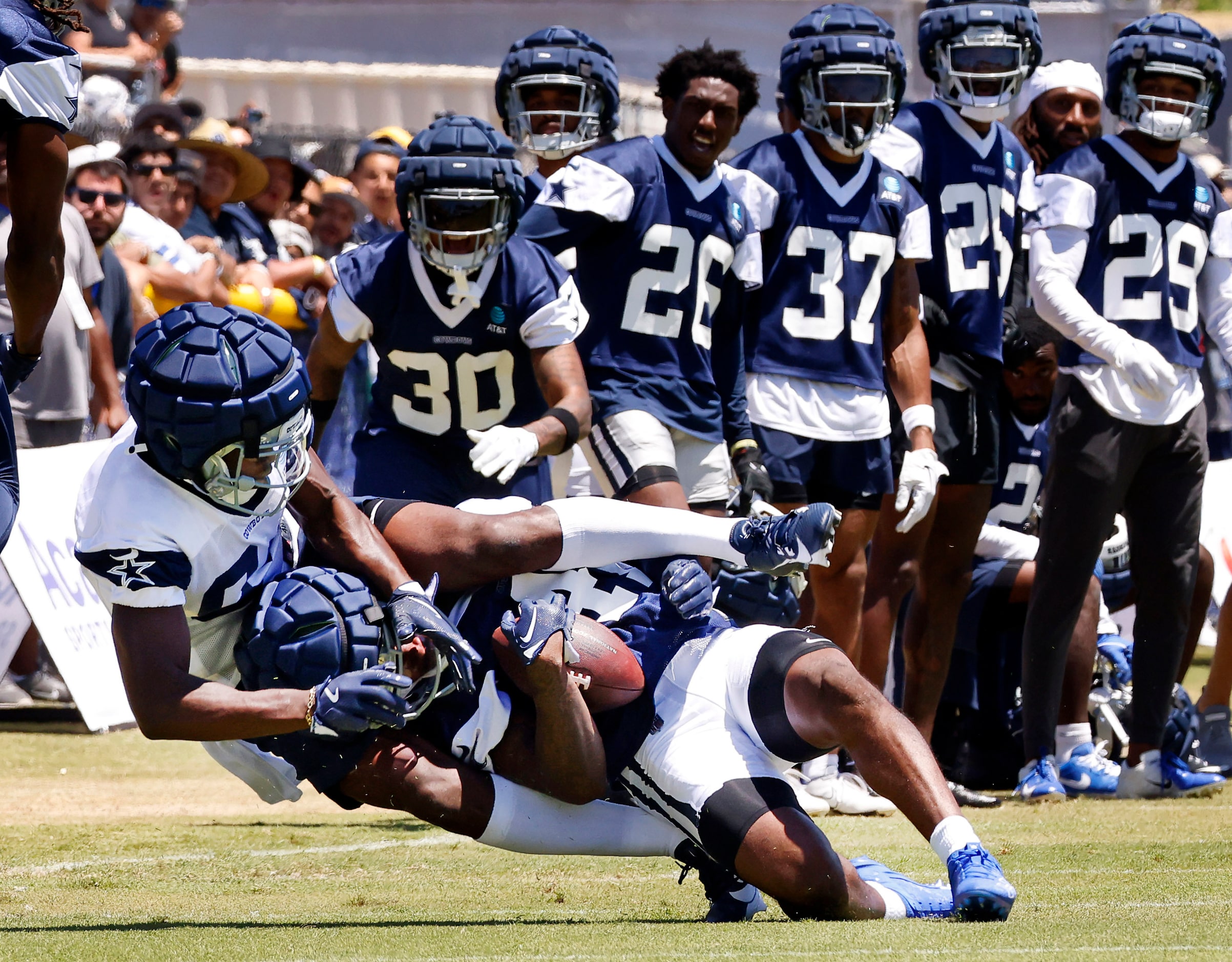 Dallas Cowboys cornerback Caelen Carson (41, right) comes down with an interception as he...