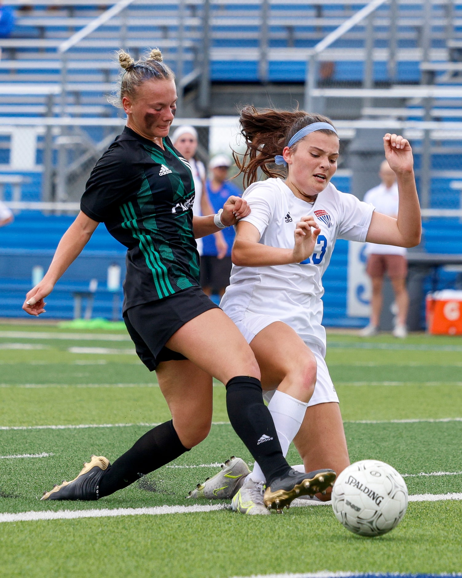 Austin Westlake defender Alex Biles (23) tackles Southlake Carroll midfielder Kennedy Fuller...