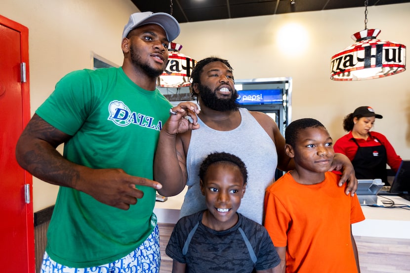 Dallas Cowboys linebacker Micah Parsons, left, poses for a photo with Tylin Hill, showing an...